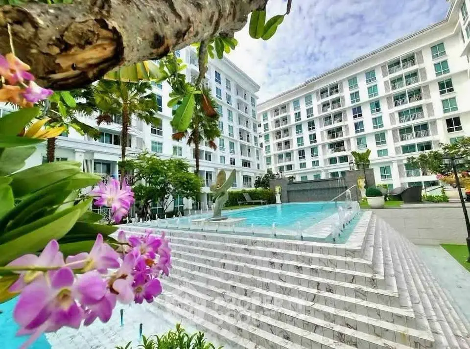 Luxurious residential complex with stunning pool and lush landscaping