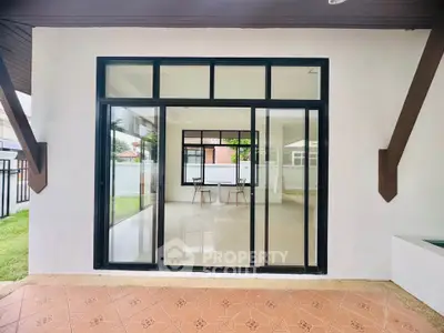 Spacious modern home with large glass doors and open interior view