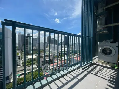 Stunning city view from a modern balcony with washing machine, perfect for urban living.