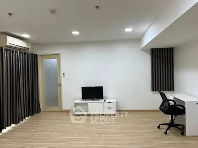 Spacious modern living room with sleek furniture and natural light