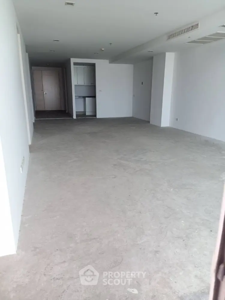 Spacious unfurnished apartment interior with open layout and modern design