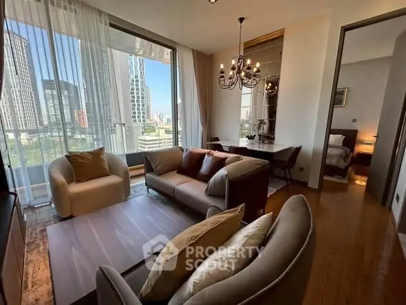 Luxurious living room with stunning city view, elegant chandelier, and cozy seating area in modern apartment.