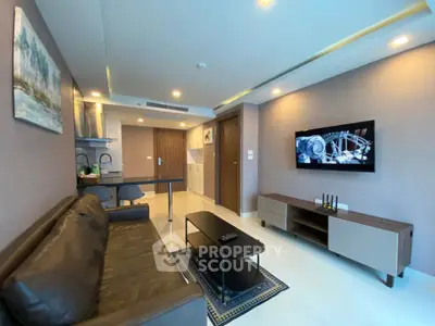 Modern living room with sleek furniture and open kitchen layout