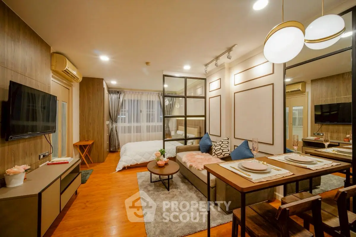 Modern studio apartment with open layout, stylish decor, and cozy ambiance.
