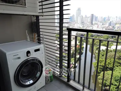 High-rise balcony with washing machine and stunning city view