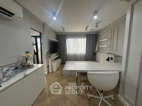 Modern study room with sleek white furniture and elegant decor
