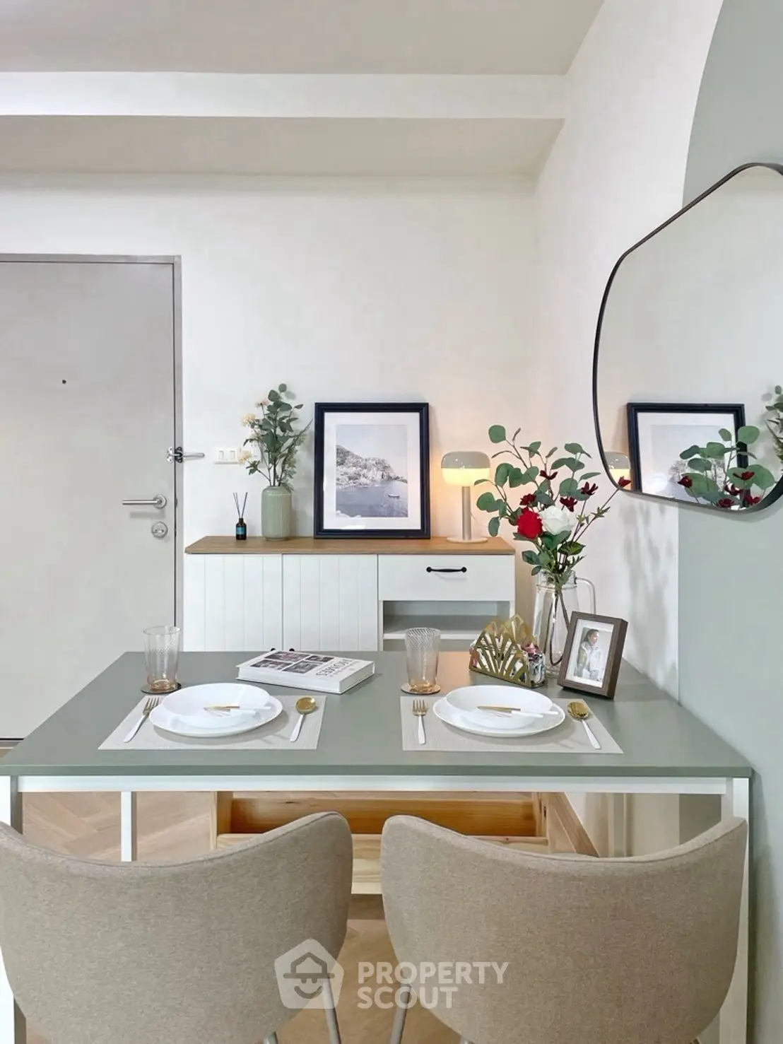 Chic dining area with modern decor and elegant table setting in a stylish apartment.