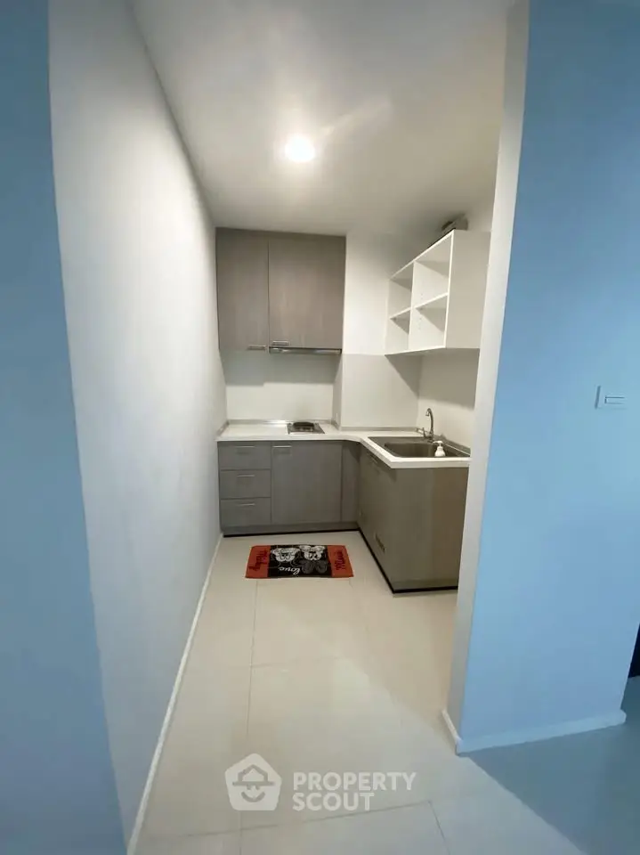 Compact modern kitchen with sleek cabinetry and minimalist design