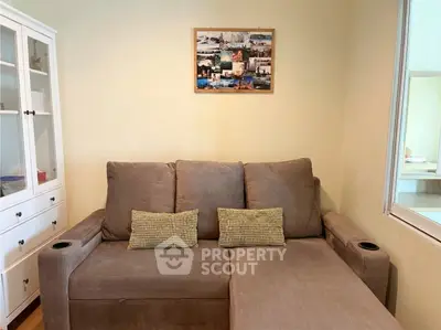 Cozy living room with comfortable sofa and stylish decor