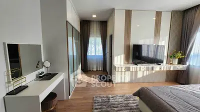 Modern bedroom with stylish decor and large windows for natural light