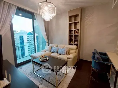 Luxurious living room with elegant chandelier and city view balcony