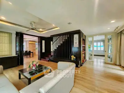 Spacious modern living room with elegant staircase and open layout