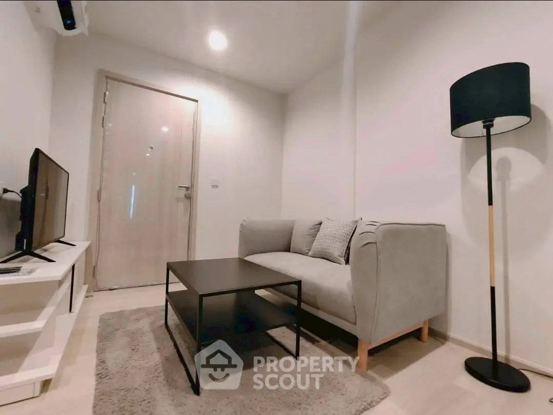 Cozy modern living room with stylish furniture and soft lighting, perfect for relaxation.