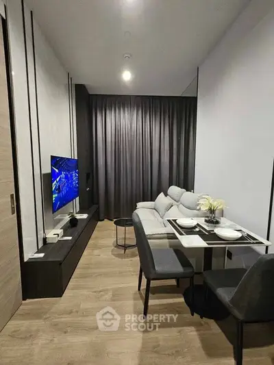 Modern living room with sleek furniture and elegant decor, perfect for urban living.
