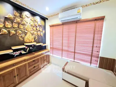 Elegant living room with unique wall art and modern air conditioning, featuring stylish wooden furniture and blinds.