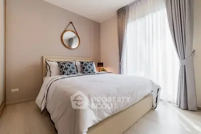 Elegant bedroom with stylish decor and natural light