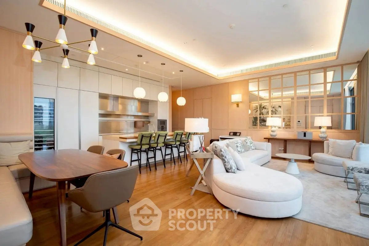 Luxurious open-plan living room with modern kitchen and elegant furnishings