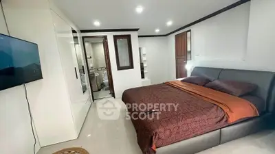 Spacious modern bedroom with sleek design and ensuite bathroom