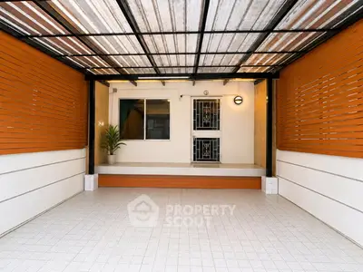 Spacious covered patio with modern design and tiled flooring