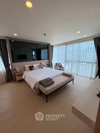 Luxurious bedroom with panoramic windows and elegant decor