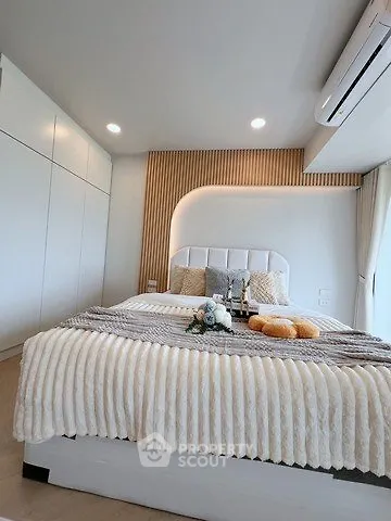 Modern bedroom with stylish decor and cozy bedding