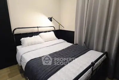 Cozy bedroom with modern metal bed frame and elegant lighting