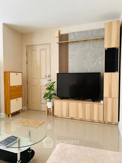 Modern living room with stylish wooden furniture and sleek TV setup