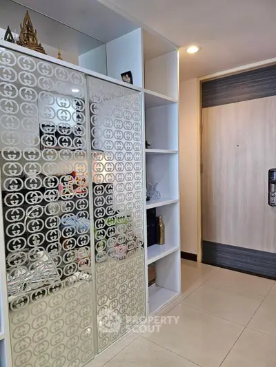 Modern apartment entrance with stylish shelving and decorative elements