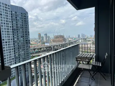 Stunning city view from high-rise balcony with modern furniture