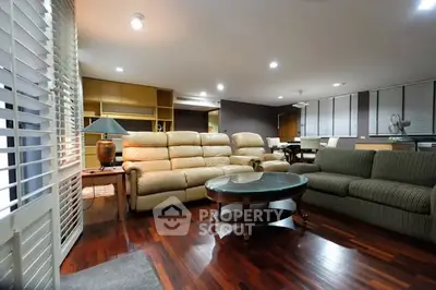 Spacious living room with elegant furniture and wooden flooring