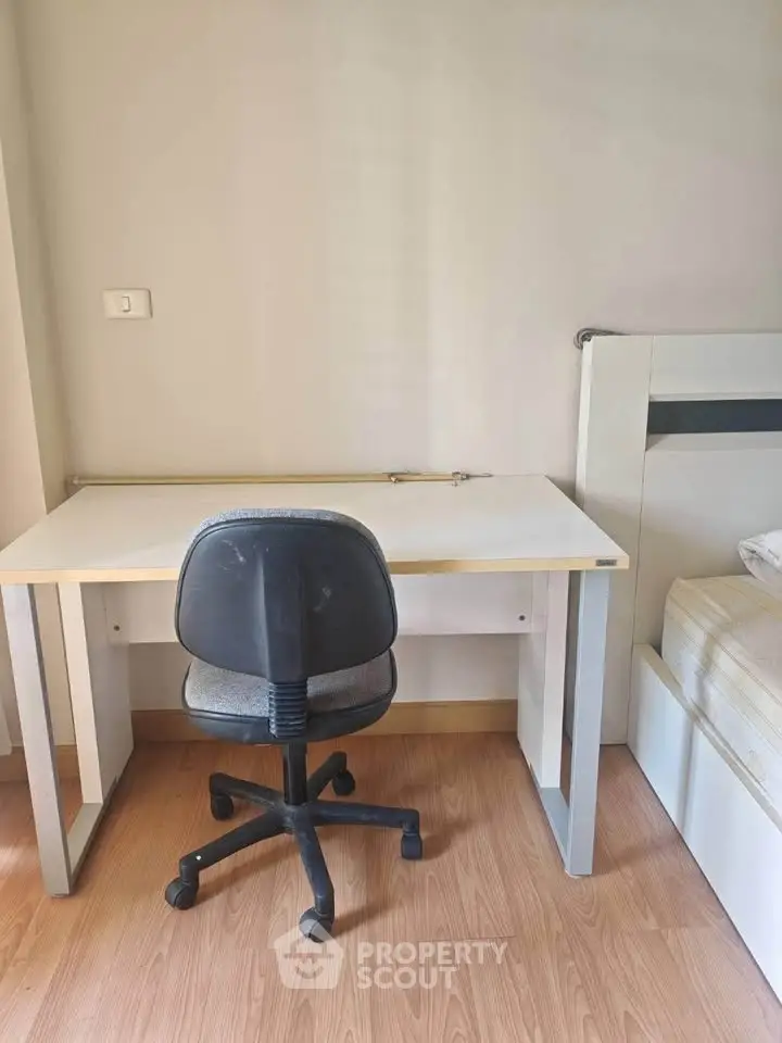 Cozy study area with desk and chair in a modern apartment