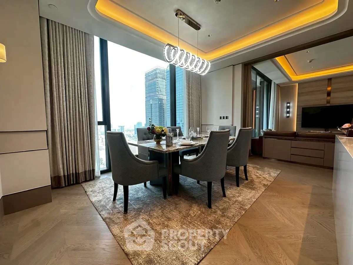 Luxurious dining area with modern lighting and city view in upscale apartment