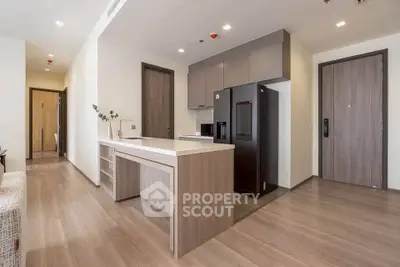 Modern kitchen with sleek design and high-end appliances in a stylish apartment.