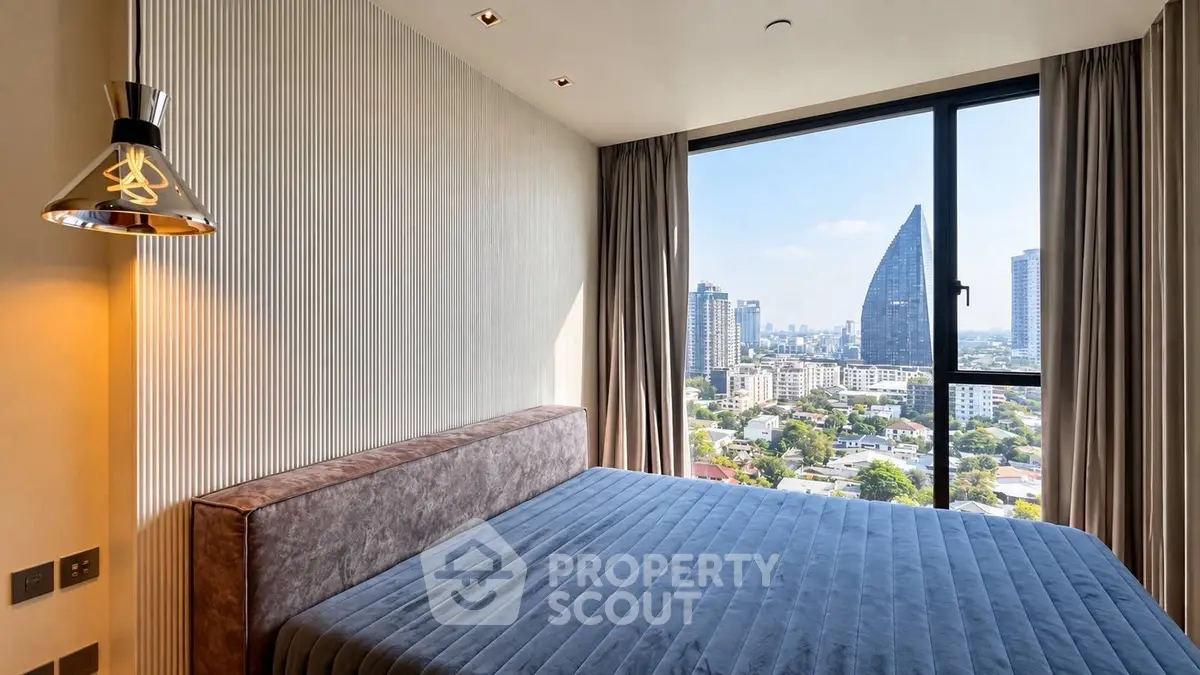 Luxurious bedroom with stunning city view in modern high-rise apartment
