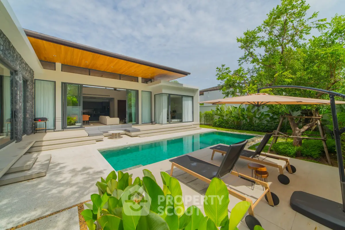 Luxurious modern villa with private pool and lush garden, perfect for relaxation and entertaining.