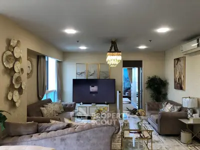Luxurious living room with elegant decor and plush seating in a modern apartment.