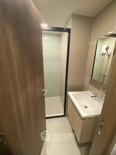 Modern bathroom with sleek design and glass shower enclosure