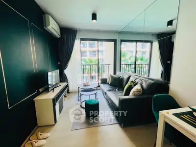 Modern living room with stylish decor and balcony view in a luxury apartment.