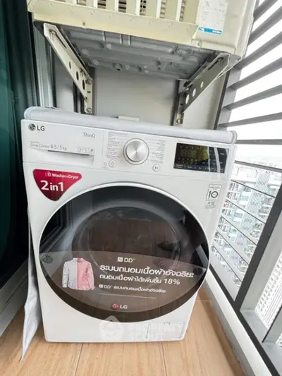 Modern balcony with LG washer dryer combo, perfect for urban living convenience.