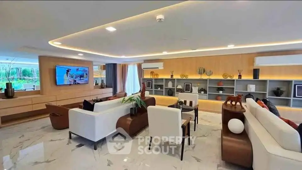 Luxurious modern living room with elegant decor and spacious seating area, perfect for relaxation and entertainment.