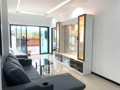 Modern living room with sleek sofa and stylish entertainment unit