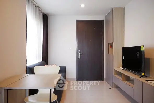 Modern living room with sleek furniture and natural light, perfect for urban living.