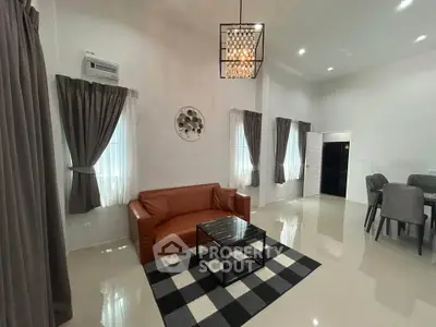 Spacious modern living room with elegant decor and ample natural light