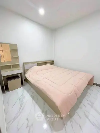 Modern minimalist bedroom with sleek furniture and cozy ambiance