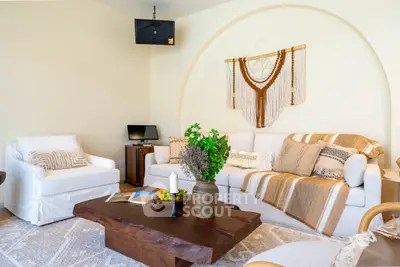 Charming living room with cozy seating and rustic decor, perfect for relaxation and entertaining.
