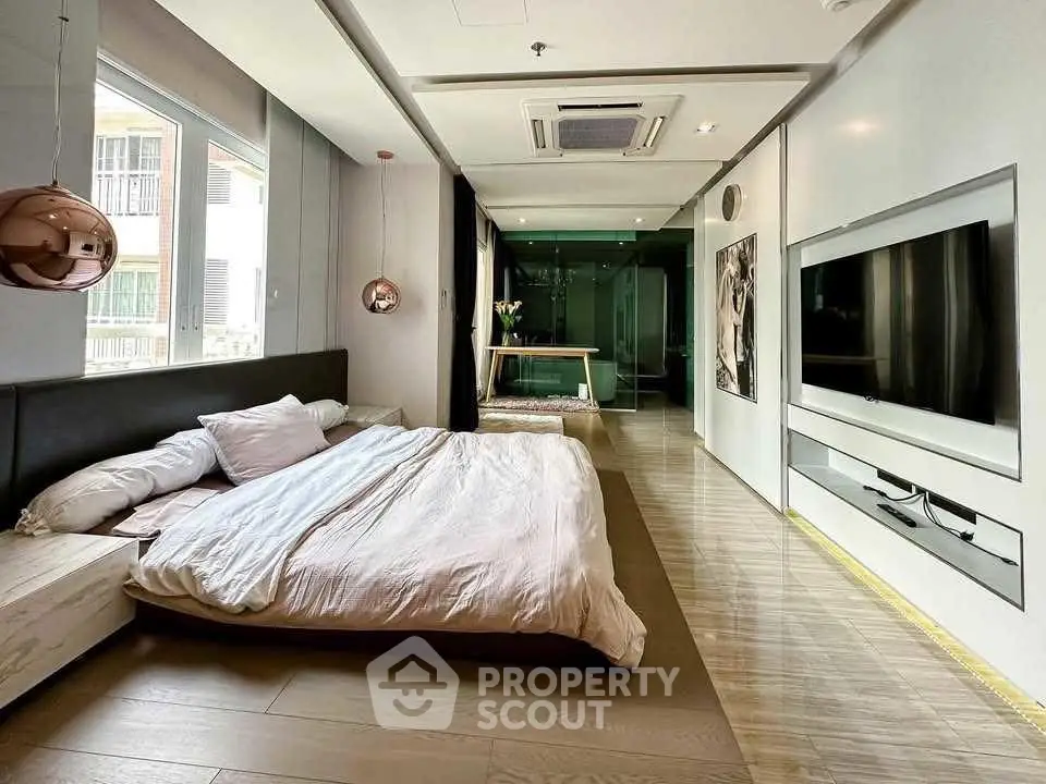 Luxurious modern bedroom with sleek design and large windows