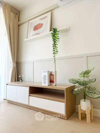 Modern living room with stylish wooden cabinet and elegant decor