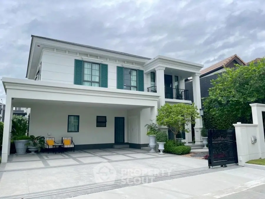 Elegant two-story house with modern facade and spacious driveway