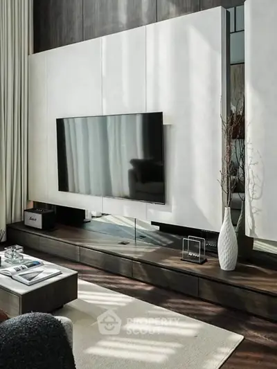 Luxurious modern living room with sleek TV setup and elegant decor