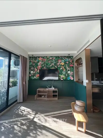 Stylish living room with vibrant floral accent wall and modern decor